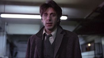 Movie still from “And Justice for All” (1979), directed by Norman Jewison – A person wearing a suit and tie; Close Up shot, Low angle