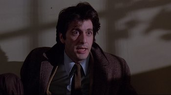 Movie still from “And Justice for All” (1979), directed by Norman Jewison – A person wearing a suit and tie; Close Up shot, Low angle