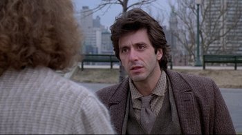 Movie still from “And Justice for All” (1979), directed by Norman Jewison – A man in a suit and tie talking to another man in a suit and tie; Close Up shot, Over the shoulder angle