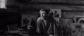 Movie still from “Andrei Rublev” (1966), directed by Andrei Tarkovsky – Black and white photograph of a man with a beard; Medium shot, High angle