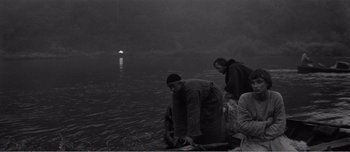 Movie still from “Andrei Rublev” (1966), directed by Andrei Tarkovsky – A group of men standing on top of a body of water; Wide shot, High angle