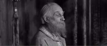 Movie still from “Andrei Rublev” (1966), directed by Andrei Tarkovsky – An old man with a long white beard; Close Up shot, High angle