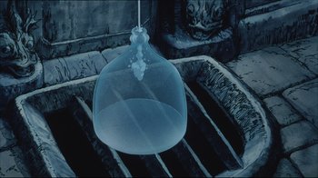 Movie still from “Angel's Egg” (1985), directed by Mamoru Oshii – An empty glass bowl hanging from the ceiling of a room; Extreme Close Up shot, High angle