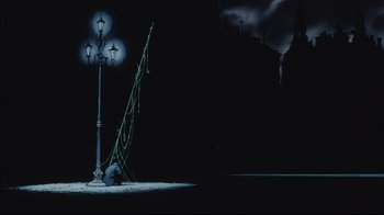 Movie still from “Angel's Egg” (1985), directed by Mamoru Oshii – A lamp post and street light in a dark place; Extreme Wide shot, Low angle