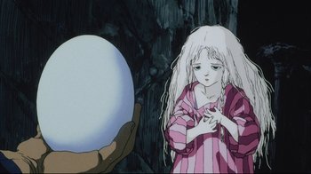 Movie still from “Angel's Egg” (1985), directed by Mamoru Oshii – A woman holding a ball in front of a person; Close Up shot, Low angle