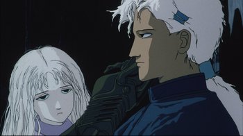 Movie still from “Angel's Egg” (1985), directed by Mamoru Oshii – An animated scene of a man and a woman looking at each other; Close Up shot, Low angle