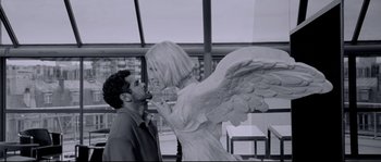 Movie still from “Angel-A” (2005), directed by Luc Besson – A man and a woman standing next to each other; Medium shot, Over the shoulder angle
