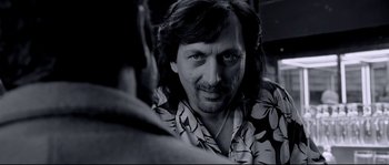 Movie still from “Angel-A” (2005), directed by Luc Besson – A person wearing a hawaiian shirt; Close Up shot, Over the shoulder angle