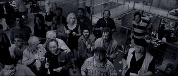 Movie still from “Angel-A” (2005), directed by Luc Besson – A black and white photo of a group of people; Wide shot, High angle