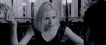 Movie still from “Angel-A” (2005), directed by Luc Besson – A black and white photo of a woman in a black dress; Close Up shot, Over the shoulder angle