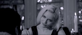 Movie still from “Angel-A” (2005), directed by Luc Besson – A black and white photo of a woman in a black dress; Close Up shot, Over the shoulder angle