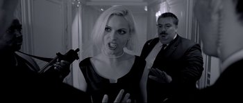 Movie still from “Angel-A” (2005), directed by Luc Besson – A woman in a black dress and a man in a black suit; Medium shot, Over the shoulder angle