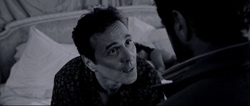 Movie still from “Angel-A” (2005), directed by Luc Besson – A black and white photo of a man looking up; Close Up shot, Over the shoulder angle