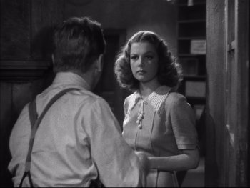 Movie still from “Angels with Dirty Faces” (1938), directed by Michael Curtiz – A man and a woman are talking in front of a mirror; Medium shot, Over the shoulder angle