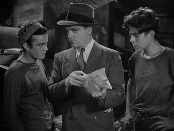Movie still from “Angels with Dirty Faces” (1938), directed by Michael Curtiz – A group of men standing next to each other in a room; Medium shot, High angle