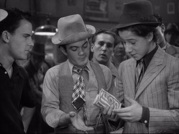 Movie still from “Angels with Dirty Faces” (1938), directed by Michael Curtiz – A group of young men standing next to each other; Medium shot, High angle