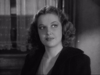 Movie still from “Angels with Dirty Faces” (1938), directed by Michael Curtiz – An old black and white photo of a woman; Close Up shot, Low angle