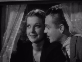 Movie still from “Angels with Dirty Faces” (1938), directed by Michael Curtiz – A man and a woman looking at each other through a window; Close Up shot, Low angle
