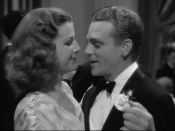 Movie still from “Angels with Dirty Faces” (1938), directed by Michael Curtiz – A man and a woman are dancing in a black - and - white photo; Close Up shot, Low angle
