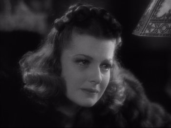 Movie still from “Angels with Dirty Faces” (1938), directed by Michael Curtiz – A black - and - white photo of a woman in a fur coat; Close Up shot, High angle