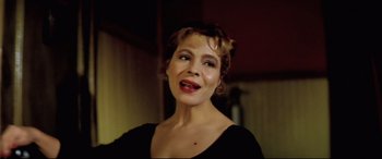 Movie still from “Anguish” (1987), directed by Bigas Luna – A person wearing a black shirt; Close Up shot, High angle