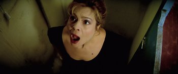 Movie still from “Anguish” (1987), directed by Bigas Luna – A person with her mouth wide open; Close Up shot, High angle
