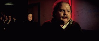 Movie still from “Anguish” (1987), directed by Bigas Luna – A man and a girl in a dark room; Close Up shot, Low angle