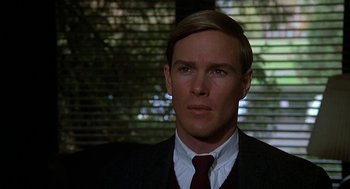 Movie still from “National Lampoon's Animal House” (1978), directed by John Landis – A person wearing a suit and tie; Close Up shot, Over the shoulder angle