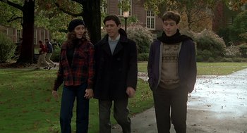 Movie still from “National Lampoon's Animal House” (1978), directed by John Landis – A group of young people standing on a sidewalk; Medium shot, High angle