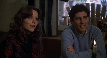 Movie still from “National Lampoon's Animal House” (1978), directed by John Landis – A man and a woman sitting next to each other in a room; Close Up shot, Low angle