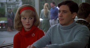 Movie still from “National Lampoon's Animal House” (1978), directed by John Landis – A man and a woman sitting next to each other; Close Up shot, Over the shoulder angle