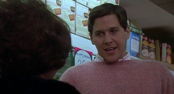Movie still from “National Lampoon's Animal House” (1978), directed by John Landis – A man talking to a woman in a pink sweater; Close Up shot, Over the shoulder angle