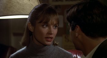Movie still from “National Lampoon's Animal House” (1978), directed by John Landis – A woman in a sweater is talking to a man in a sweater; Close Up shot, Over the shoulder angle