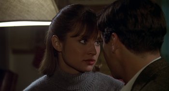 Movie still from “National Lampoon's Animal House” (1978), directed by John Landis – A woman in a gray sweater is looking at a man in a gray sweater; Close Up shot, Over the shoulder angle