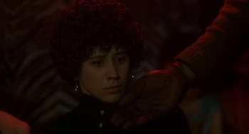 Movie still from “National Lampoon's Animal House” (1978), directed by John Landis – A person with a hand touching the shoulder of another person; Close Up shot, Over the shoulder angle