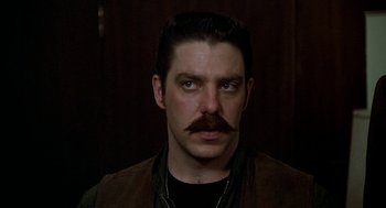 Movie still from “National Lampoon's Animal House” (1978), directed by John Landis – A person with a mustache; Close Up shot, Low angle