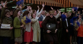 Movie still from “National Lampoon's Animal House” (1978), directed by John Landis – A group of people standing in front of a crowd; Wide shot, High angle