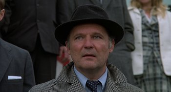Movie still from “National Lampoon's Animal House” (1978), directed by John Landis – A man wearing a hat and a jacket; Close Up shot, Low angle