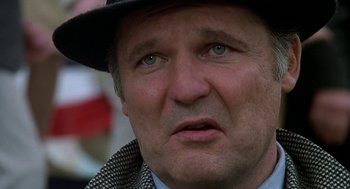 Movie still from “National Lampoon's Animal House” (1978), directed by John Landis – A person wearing a hat; Close Up shot, Low angle