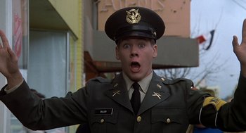Movie still from “National Lampoon's Animal House” (1978), directed by John Landis – A man in a military uniform with a surprised look on his face; Close Up shot, Low angle