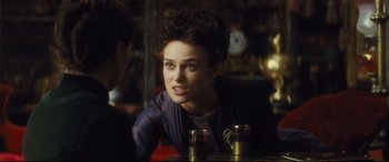 Movie still from “Anna Karenina” (2012), directed by Joe Wright – A person sitting at a table; Close Up shot, Over the shoulder angle