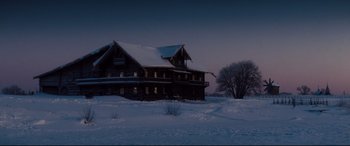 Movie still from “Anna Karenina” (2012), directed by Joe Wright – A house in the middle of a snowy field at night; Extreme Wide shot, Low angle