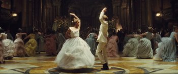 Movie still from “Anna Karenina” (2012), directed by Joe Wright – A man and a woman dancing in a ballroom; Wide shot, High angle