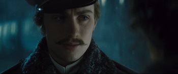 Movie still from “Anna Karenina” (2012), directed by Joe Wright – A person wearing a hat; Close Up shot, Low angle