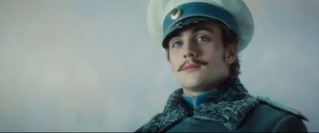 Movie still from “Anna Karenina” (2012), directed by Joe Wright – A person wearing a hat; Close Up shot, Low angle