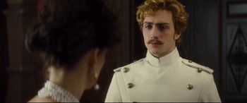 Movie still from “Anna Karenina” (2012), directed by Joe Wright – A man in a white uniform looking at a woman in a white dress; Close Up shot, Over the shoulder angle