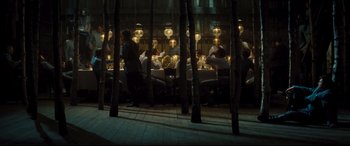 Movie still from “Anna Karenina” (2012), directed by Joe Wright – A group of people sitting at a table in front of a mirror; Wide shot, High angle