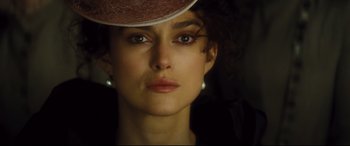 Movie still from “Anna Karenina” (2012), directed by Joe Wright – A person wearing a hat; Close Up shot, Over the shoulder angle