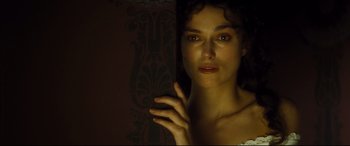 Movie still from “Anna Karenina” (2012), directed by Joe Wright – A beautiful woman with long dark curly hair; Close Up shot, High angle