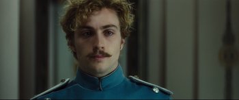 Movie still from “Anna Karenina” (2012), directed by Joe Wright – A person wearing a uniform; Close Up shot, Over the shoulder angle